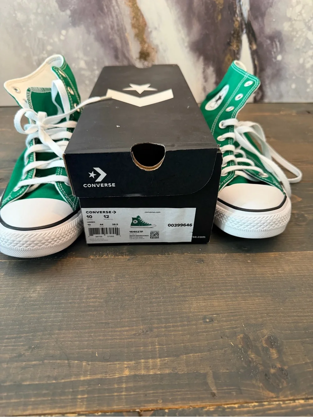Converse Chuck Taylor All Star High Tops in “Amazon Green / White / White.”